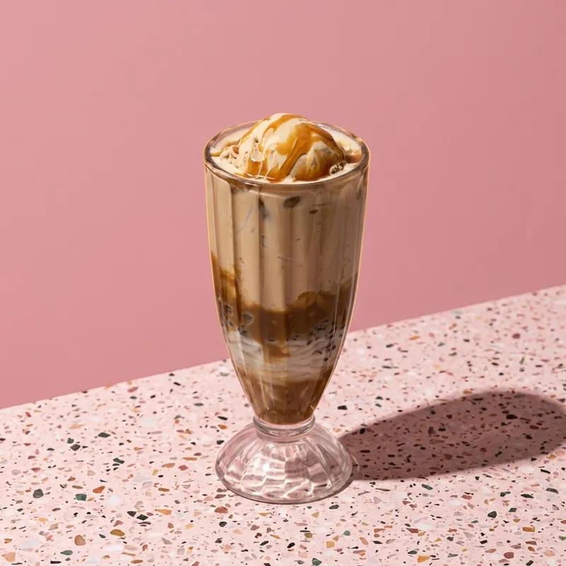 Salted Sunset Falooda — rich butterscotch, salted caramel crunch, and double cream layers. Pure bliss.
